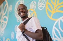 Black male student with backpack